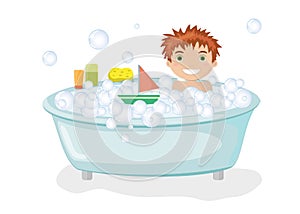 Cute boy taking bath with bubbles and toys