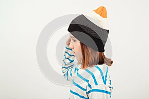 Cute boy thinking and looking aside, over white background. Thoughtful clever schooler. Student with serious expression, child