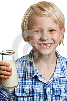 Cute boywith milk moustache and bottle