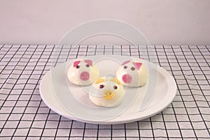 Children\'s breakfast. Fancy Dim sum, chinese steamed bun. Pig face shape