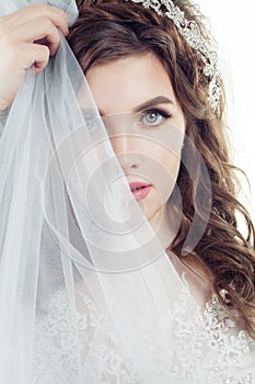 Cute bride woman in veil, face closeup female portrait.