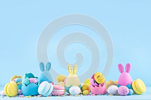 Cute and bright pastel colored Easter eggs and bunny background