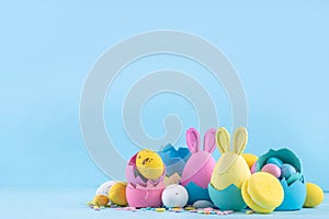 Cute and bright pastel colored Easter eggs and bunny background