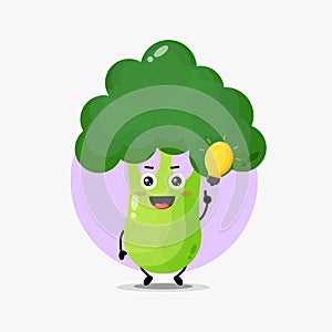Cute broccoli character with light bulb idea