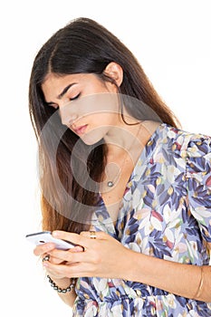 cute brunette woman with long dark hair holding texting using cell mobile phone on white background