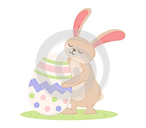 Cute bunny hugging a decorated Easter egg. Vector isolated cartoon illustration of a rabbit in a clearing