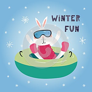 Cute bunny snow tubing in winter
