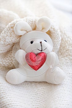 Cute bunny toy with red heart, home decoration with soft toys on bedroom for children and nursery