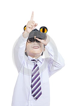 Cute business kid holding binoculars - isolated