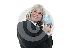 Cute business woman holding a piggy bank