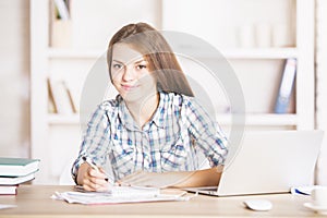 Cute businesslady at office table