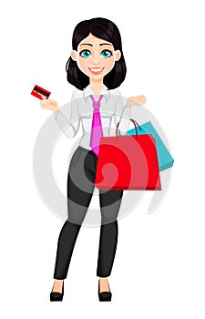 Young beautiful business woman holding credit card and paper bags