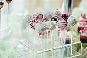 Cute candy bar with various candies and cakes. Wedding candybar