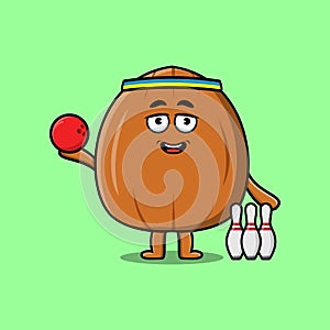 Cute cartoon Almond nut character playing bowling