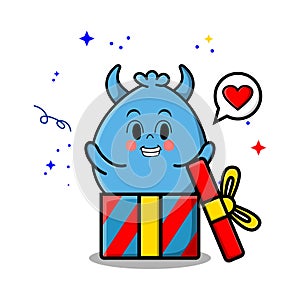 Cute cartoon monster coming out from big gift box