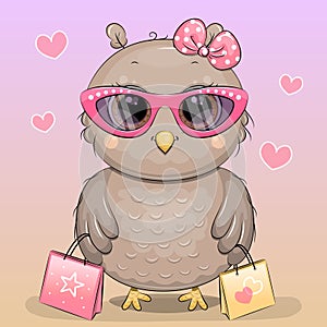 Cute cartoon owl in pink glasses and with shopping bags.