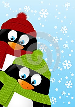 Cute cartoon penguins on winter background