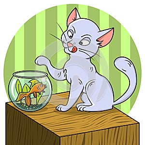 Cute cat looking at fish in a bowl