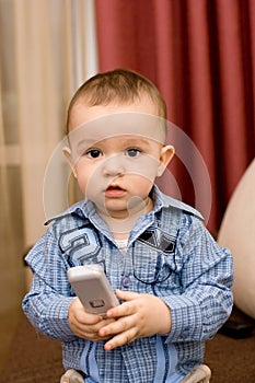 Cute caucasian boy with tv console