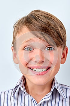 Cute caucasian child little boy smile make happy face, human emotions and children