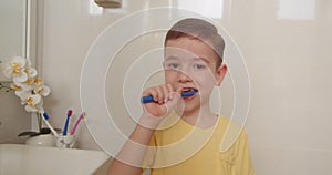 Cute Caucasian Child with white Tooth looking at mirror isolated at home. Lifestyle. Portrait happy cute young little