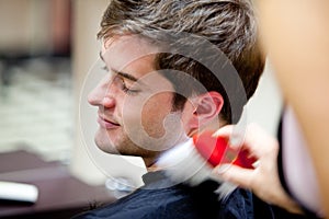 Cute caucasian customer in a hairdressing salon