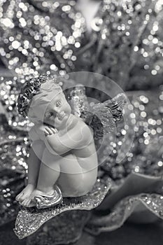 Cute ceramic angel on a Christmas background.