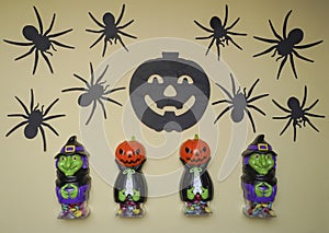 Cute characters in monster costume. Scary Halloween figurines stand on a light background close-up
