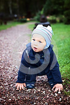 Cute charming boy near road