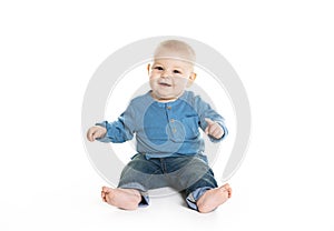 Cute cheerful crawling baby boy isolated on white background