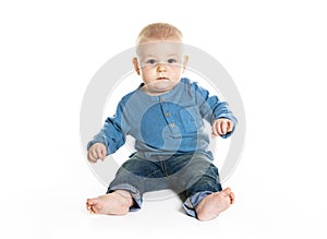 Cute cheerful crawling baby boy isolated on white background