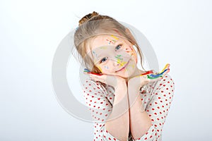 Cute cheerful kid girl poses