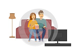 Cute cheerful laughing couple watching funny tv show, sitting on sofa at home