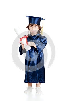 Cute child in academician clothes with roll