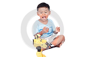 Cute child asian little boy play robot fighting toy