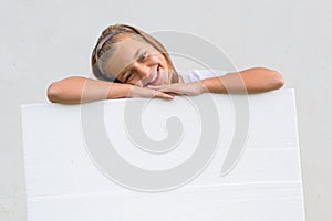 Cute child with blank paper photo