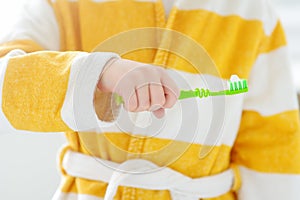 Cute child brushing teeth. Preschooler boy using toothpaste and toothbrush in bathroom during morning routine. Baby learning brush