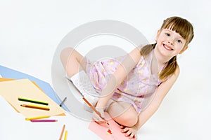 Cute child draw with colorful crayons and smile