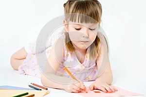 Cute child draw with colorful crayons and smile