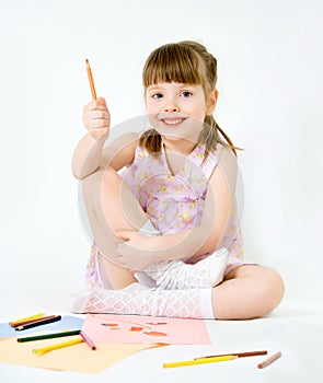 Cute child draw with colorful crayons and smile