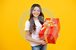 Cute child girl congratulate with valentines day, giving romantic gift box. Present, greeting and gifting birthday