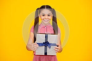 Cute child girl congratulate with valentines day, giving romantic gift box. Present, greeting and gifting birthday