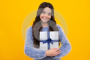 Cute child girl congratulate with valentines day, giving romantic gift box. Present, greeting and gifting birthday