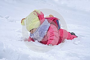 Cute child girl on snow. Winter outdoor activities