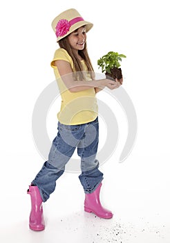 Cute Child Holding Plant