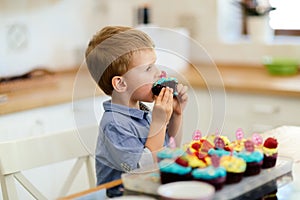 Cute child learning to become a chef since the age of 2