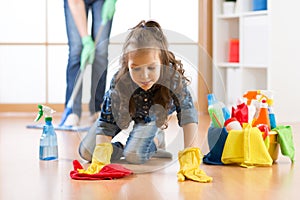 Cute child little girl with mother cleanse a floor in nursery at home