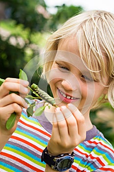 Cute child looking at a caterpillar