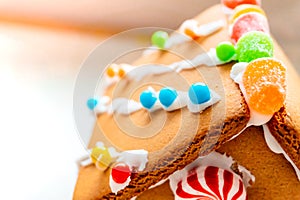 Cute, child-made gingerbread house, with imperfections a real gingerbread house assembly, for the Christmas holiday season, as a