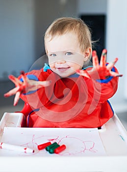 Cute child with painted hands photo